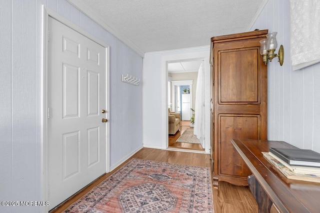 116 Curtis Ave, Manasquan, NJ 08736 - entrance foyer featuring ornamental molding, wood finished floors, a textured ceiling, and baseboards