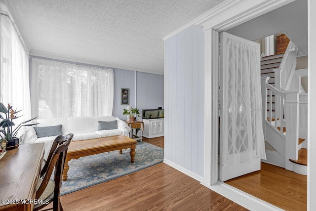 116 Curtis Ave, Manasquan, NJ 08736 - living area featuring a textured ceiling, stairway, crown molding, and wood finished floors