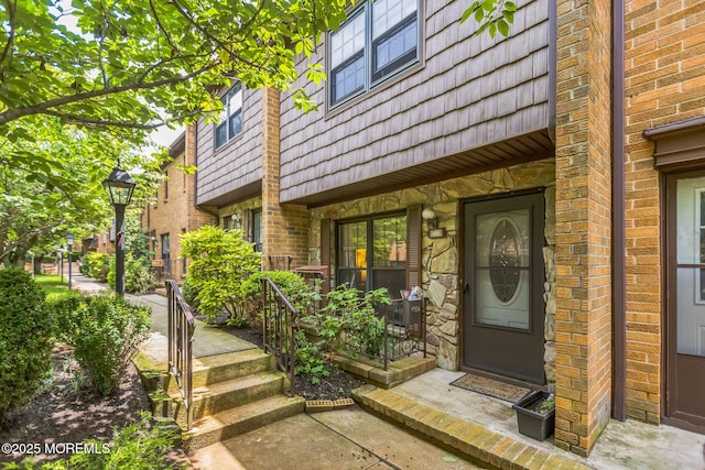 321 Spring St Unit 8, Red Bank, NJ 07701 - doorway to property with mansard roof, a porch, and brick siding