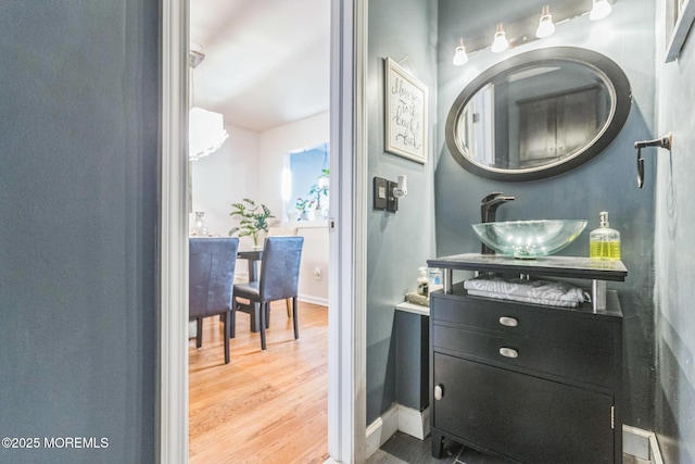 321 Spring St Unit 8, Red Bank, NJ 07701 - bathroom featuring wood finished floors, vanity, and baseboards