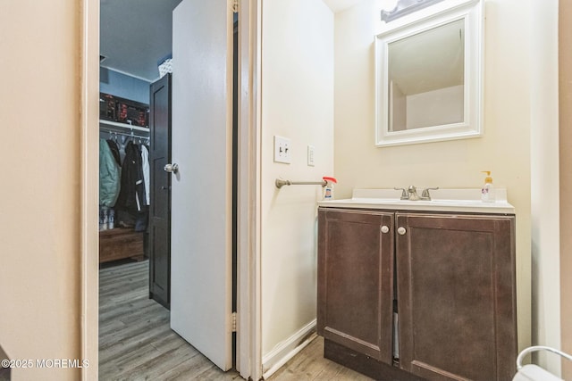 321 Spring St Unit 8, Red Bank, NJ 07701 - bathroom featuring wood finished floors, vanity, and baseboards