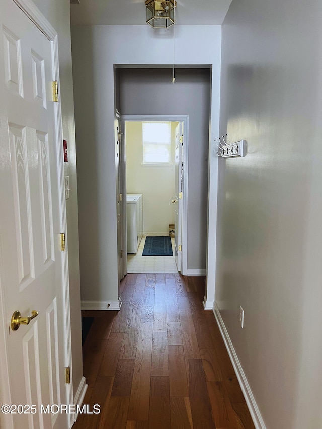 16 Woodstock Ct, Jackson, NJ 08527 - hall featuring washer / dryer and dark wood-style flooring