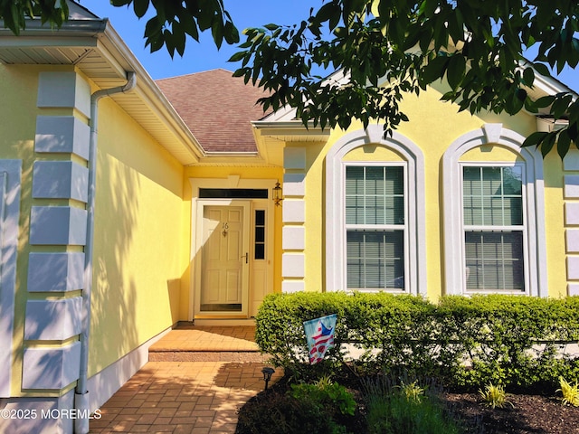 16 Woodstock Ct, Jackson, NJ 08527 - property entrance featuring a shingled roof and stucco siding