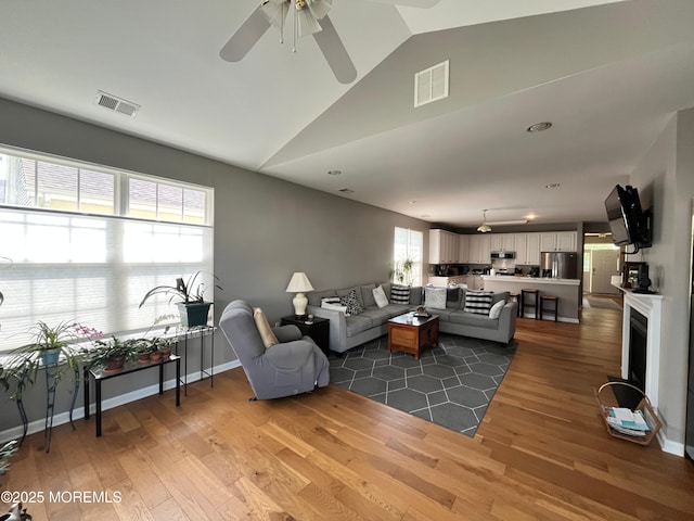 16 Woodstock Ct, Jackson, NJ 08527 - living area featuring vaulted ceiling, light wood-type flooring, and a ceiling fan