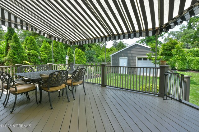 51 Clay St, Fair Haven, NJ 07704 - deck with outdoor dining space, an outdoor structure, a yard, and view of wooded area