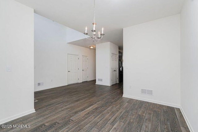11 Starry Ln, Barnegat, NJ 08005 - empty room with a chandelier and dark wood-style floors