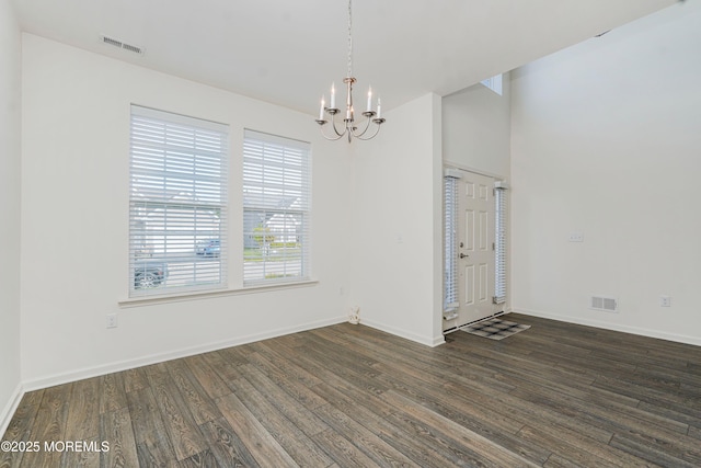 11 Starry Ln, Barnegat, NJ 08005 - unfurnished dining area featuring a chandelier and dark wood-style flooring
