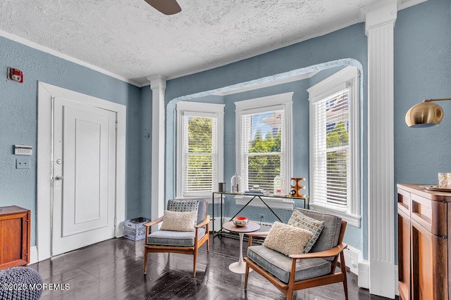 708 7th Ave, Asbury Park, NJ 07712 - living area with a textured wall, decorative columns, a textured ceiling, crown molding, and wood finished floors