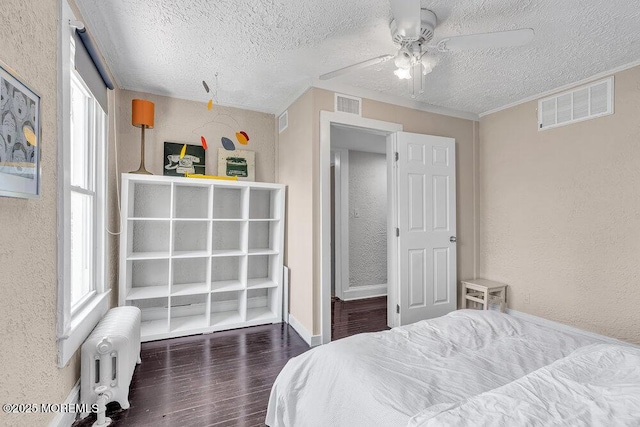 708 7th Ave, Asbury Park, NJ 07712 - bedroom with radiator, a textured wall, wood finished floors, a textured ceiling, and baseboards
