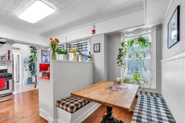 708 7th Ave, Asbury Park, NJ 07712 - dining space featuring light wood-style floors, an ornate ceiling, and ornamental molding