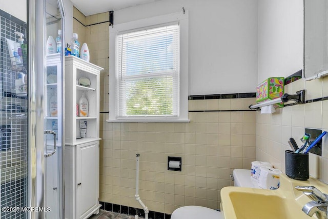 708 7th Ave, Asbury Park, NJ 07712 - bathroom with tile walls, a sink, and toilet