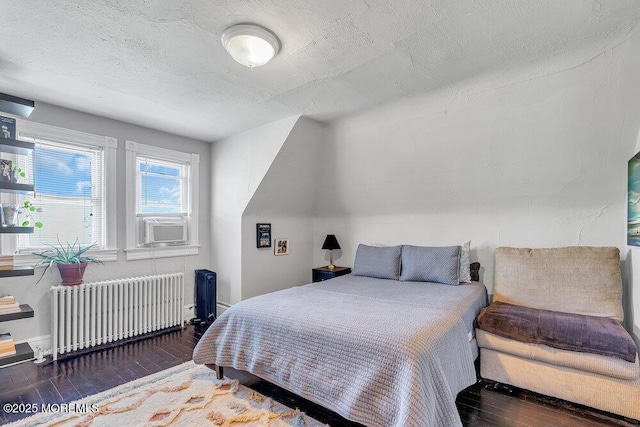 708 7th Ave, Asbury Park, NJ 07712 - bedroom featuring radiator heating unit, hardwood / wood-style floors, baseboards, a textured ceiling, and cooling unit