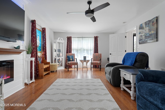 470 Nautilus Dr, Manahawkin, NJ 08050 - living area with a ceiling fan, a glass covered fireplace, and wood finished floors