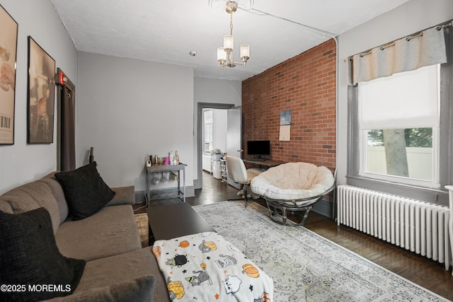 31 Riverside Ave, Red Bank, NJ 07701 - living area featuring radiator, hardwood / wood-style floors, and a chandelier