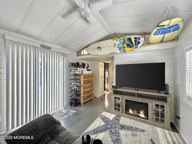 709 Union Ave Unit 5, Brielle, NJ 08730 - living area with concrete flooring, lofted ceiling, ceiling fan, healthy amount of natural light, and a large fireplace
