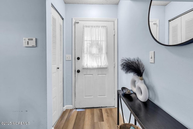 305 Daisy Ct, Jackson, NJ 08527 - doorway with wood finished floors, baseboards, and a textured ceiling