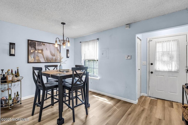 305 Daisy Ct, Jackson, NJ 08527 - dining space featuring a textured ceiling, light wood-style flooring, a chandelier, and baseboards