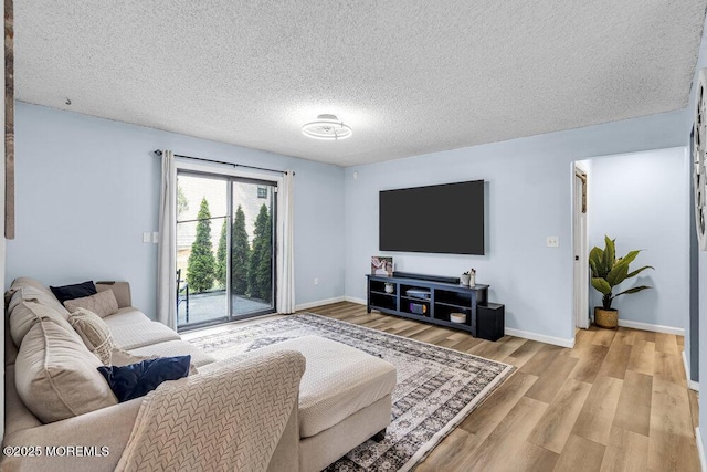 305 Daisy Ct, Jackson, NJ 08527 - living room with light wood-style floors, baseboards, and a textured ceiling