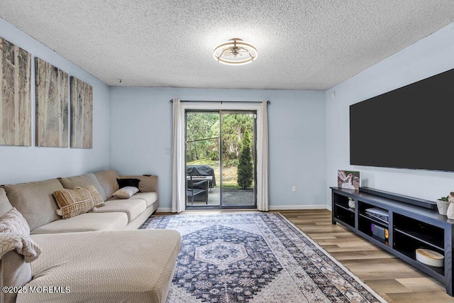 305 Daisy Ct, Jackson, NJ 08527 - living area featuring wood finished floors, a textured ceiling, and baseboards