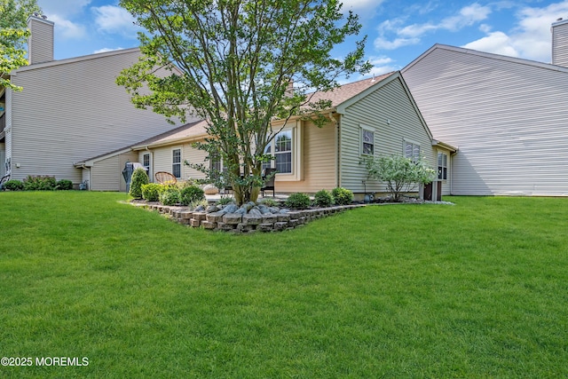 6 Claridge Ct # 5, Freehold, NJ 07728 - rear view of house featuring a chimney and a lawn
