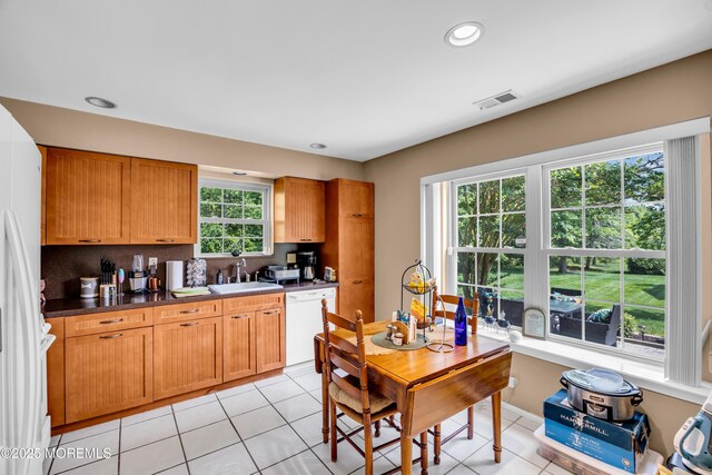 6 Claridge Ct # 5, Freehold, NJ 07728 - kitchen featuring white appliances, dark countertops, backsplash, light tile patterned floors, and recessed lighting