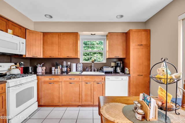 6 Claridge Ct # 5, Freehold, NJ 07728 - kitchen with white appliances, decorative backsplash, light tile patterned floors, and dark countertops