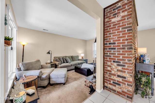 6 Claridge Ct # 5, Freehold, NJ 07728 - living room featuring light tile patterned floors and light carpet