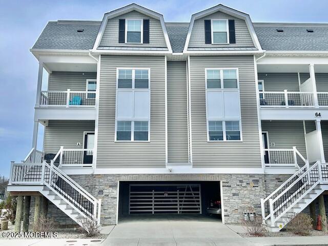 64 Sheridan Ave Unit A, Seaside Heights, NJ 08751 - view of front of property with stairway, a balcony, an attached garage, and driveway