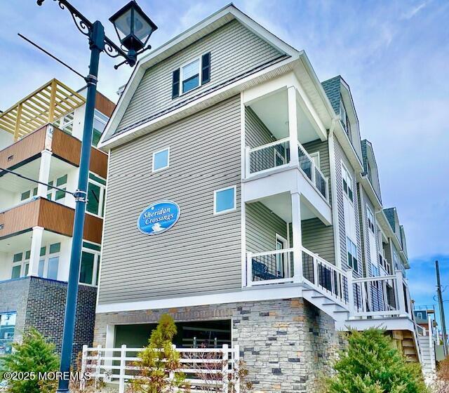 64 Sheridan Ave Unit A, Seaside Heights, NJ 08751 - view of property exterior featuring a balcony and an attached garage