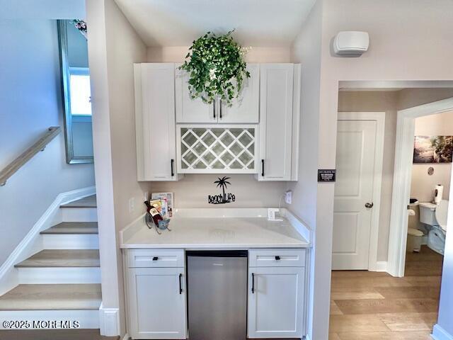 64 Sheridan Ave Unit A, Seaside Heights, NJ 08751 - indoor dry bar with fridge, light wood-type flooring, stairway, and baseboards