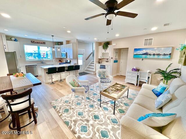 64 Sheridan Ave Unit A, Seaside Heights, NJ 08751 - living area with light wood finished floors, stairway, a ceiling fan, and recessed lighting