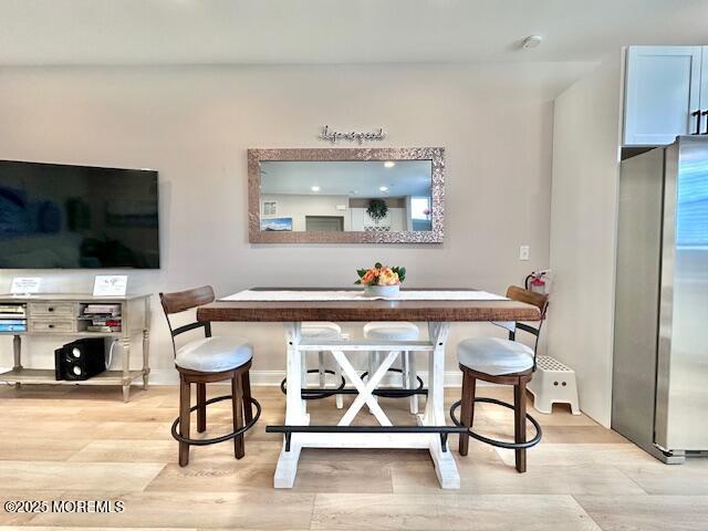 64 Sheridan Ave Unit A, Seaside Heights, NJ 08751 - bar area with freestanding refrigerator and light wood finished floors