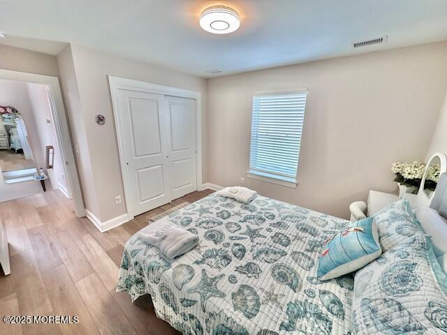 64 Sheridan Ave Unit A, Seaside Heights, NJ 08751 - bedroom with wood finished floors, baseboards, and a closet