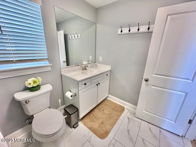 64 Sheridan Ave Unit A, Seaside Heights, NJ 08751 - bathroom featuring vanity, toilet, marble finish flooring, and baseboards