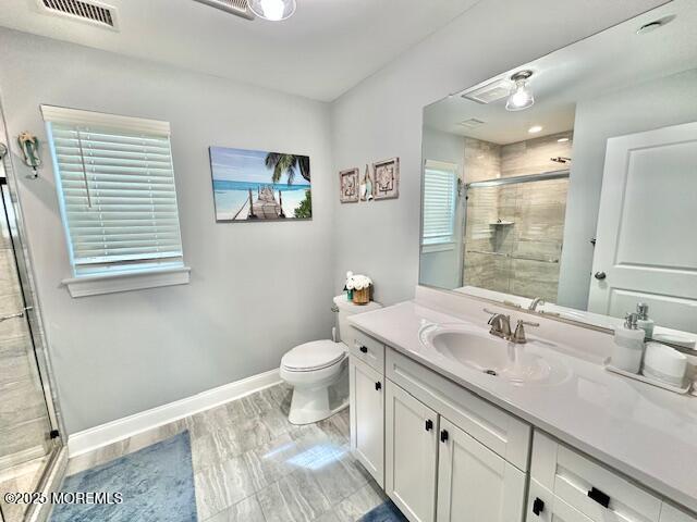 64 Sheridan Ave Unit A, Seaside Heights, NJ 08751 - full bath featuring a shower stall, vanity, toilet, and baseboards