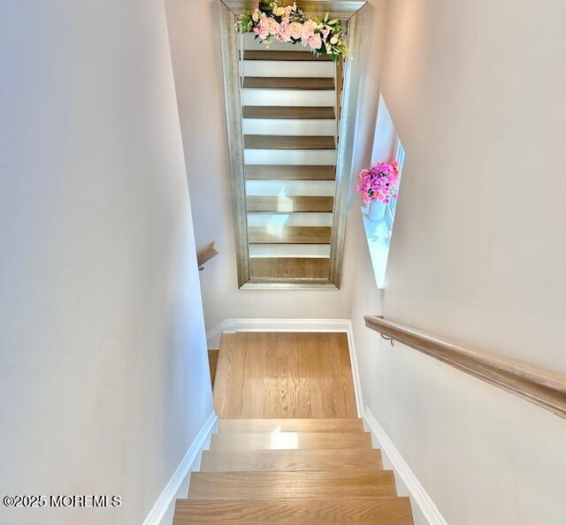 64 Sheridan Ave Unit A, Seaside Heights, NJ 08751 - staircase with baseboards and wood finished floors