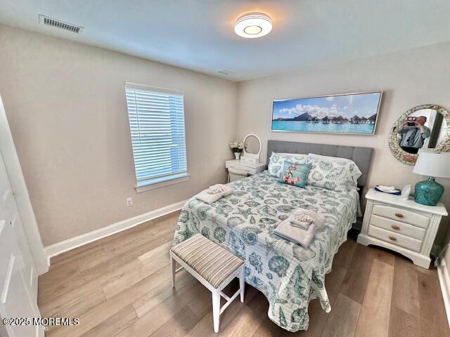 64 Sheridan Ave Unit A, Seaside Heights, NJ 08751 - bedroom with wood finished floors and baseboards