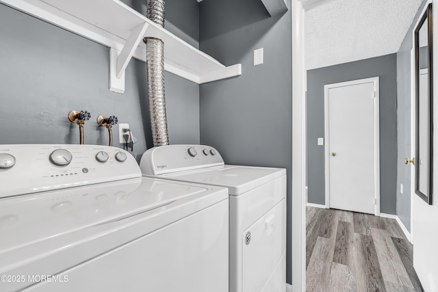 113 Whispering Oaks Way, Jackson, NJ 08527 - laundry area with light wood finished floors, separate washer and dryer, and baseboards