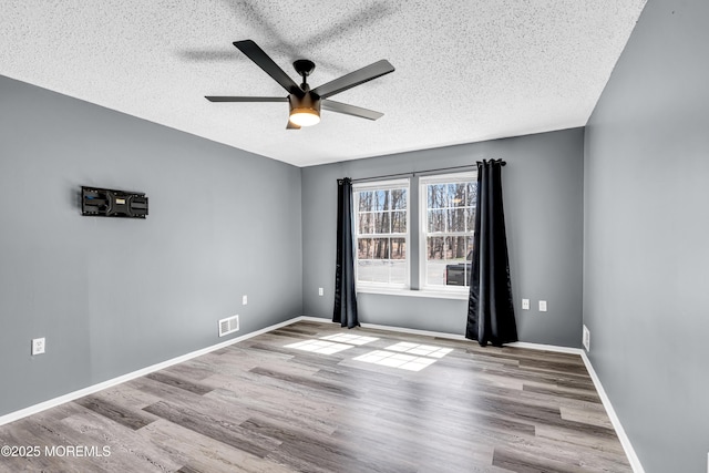 113 Whispering Oaks Way, Jackson, NJ 08527 - empty room with ceiling fan, a textured ceiling, wood finished floors, and baseboards