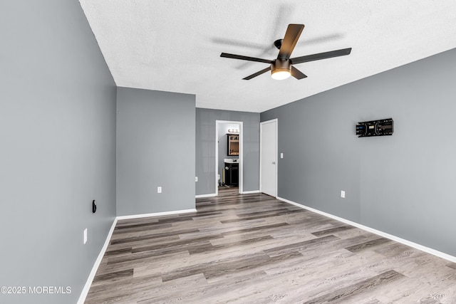113 Whispering Oaks Way, Jackson, NJ 08527 - unfurnished room featuring ceiling fan, wood finished floors, a textured ceiling, and baseboards