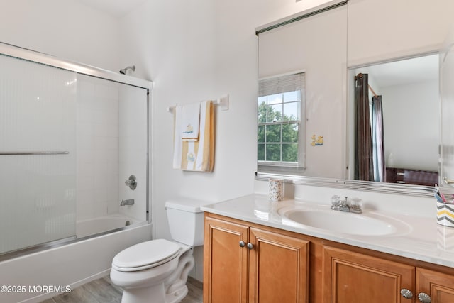 27 Witherspoon Way, Marlboro, NJ 07746 - full bath with vanity, toilet, bath / shower combo with glass door, and wood finished floors