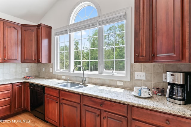 27 Witherspoon Way, Marlboro, NJ 07746 - kitchen with black dishwasher, a sink, light stone counters, vaulted ceiling, and dark brown cabinets