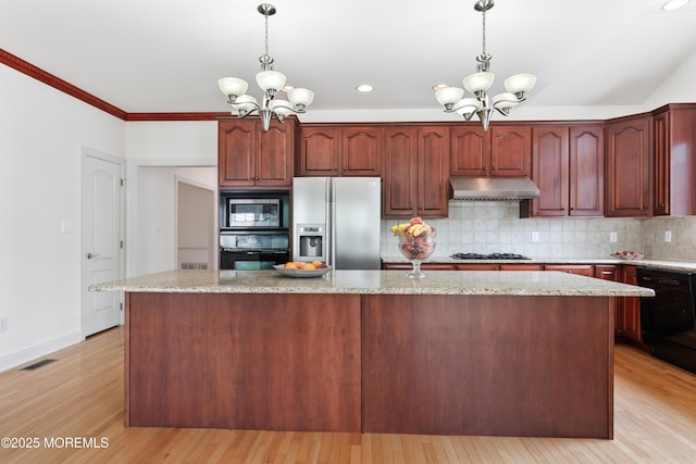 27 Witherspoon Way, Marlboro, NJ 07746 - kitchen with black appliances, a chandelier, under cabinet range hood, backsplash, and crown molding