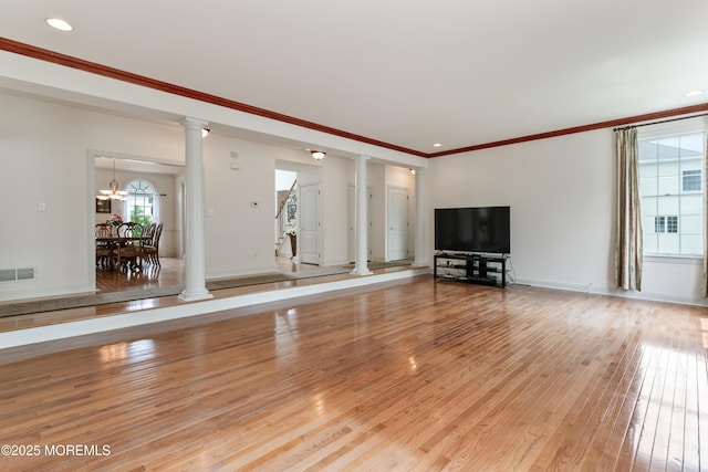 27 Witherspoon Way, Marlboro, NJ 07746 - unfurnished living room with decorative columns, light wood-style floors, crown molding, baseboards, and recessed lighting