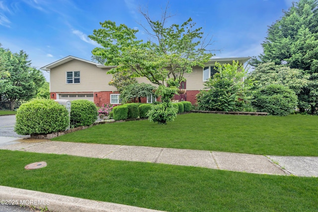 114 Greymoor Rd, Howell, NJ 07731 - view of front facade featuring brick siding, an attached garage, and a front yard