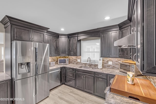 103 Idlewild Ln, Aberdeen, NJ 07747 - kitchen with appliances with stainless steel finishes, a sink, exhaust hood, light stone countertops, and recessed lighting