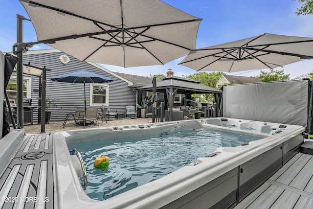 103 Idlewild Ln, Aberdeen, NJ 07747 - view of pool with a gazebo, outdoor dining area, and a covered hot tub