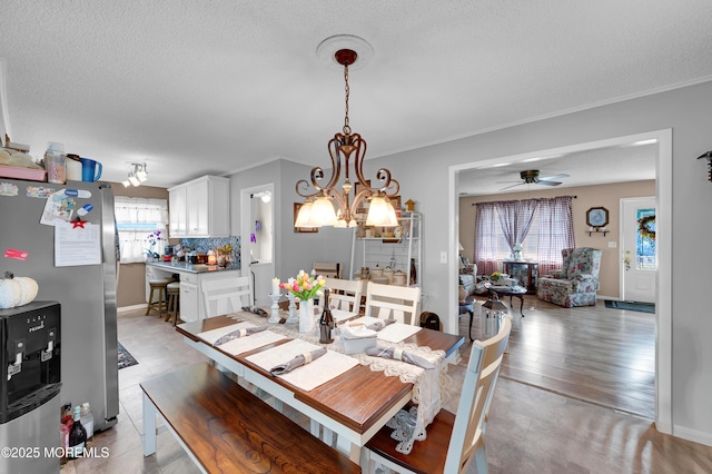 17 Evergreen Pl, Howell, NJ 07731 - dining space featuring a ceiling fan, ornamental molding, a chandelier, and a textured ceiling