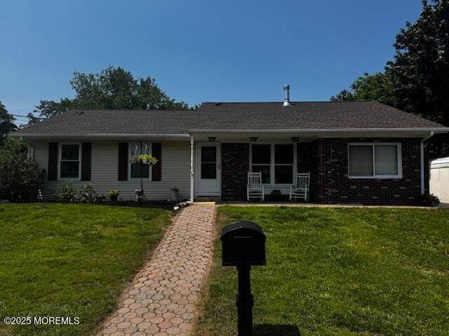 23 Terrace Ave, New Egypt, NJ 08533 - ranch-style home featuring a front yard, a porch, and brick siding