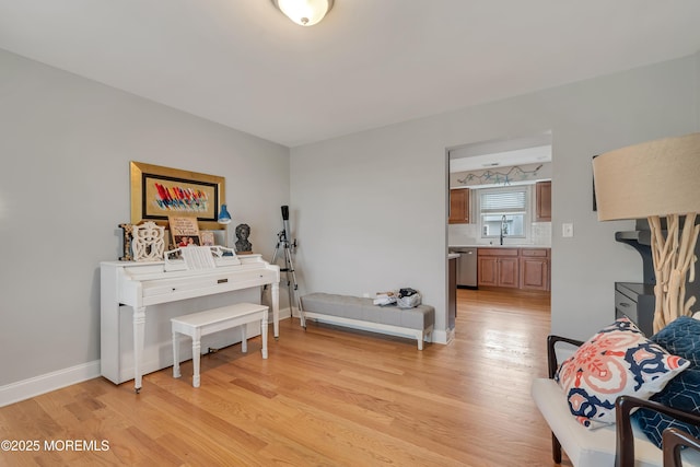 728 Brook Ave, Union Beach, NJ 07735 - interior space with light wood-style floors, a sink, and baseboards
